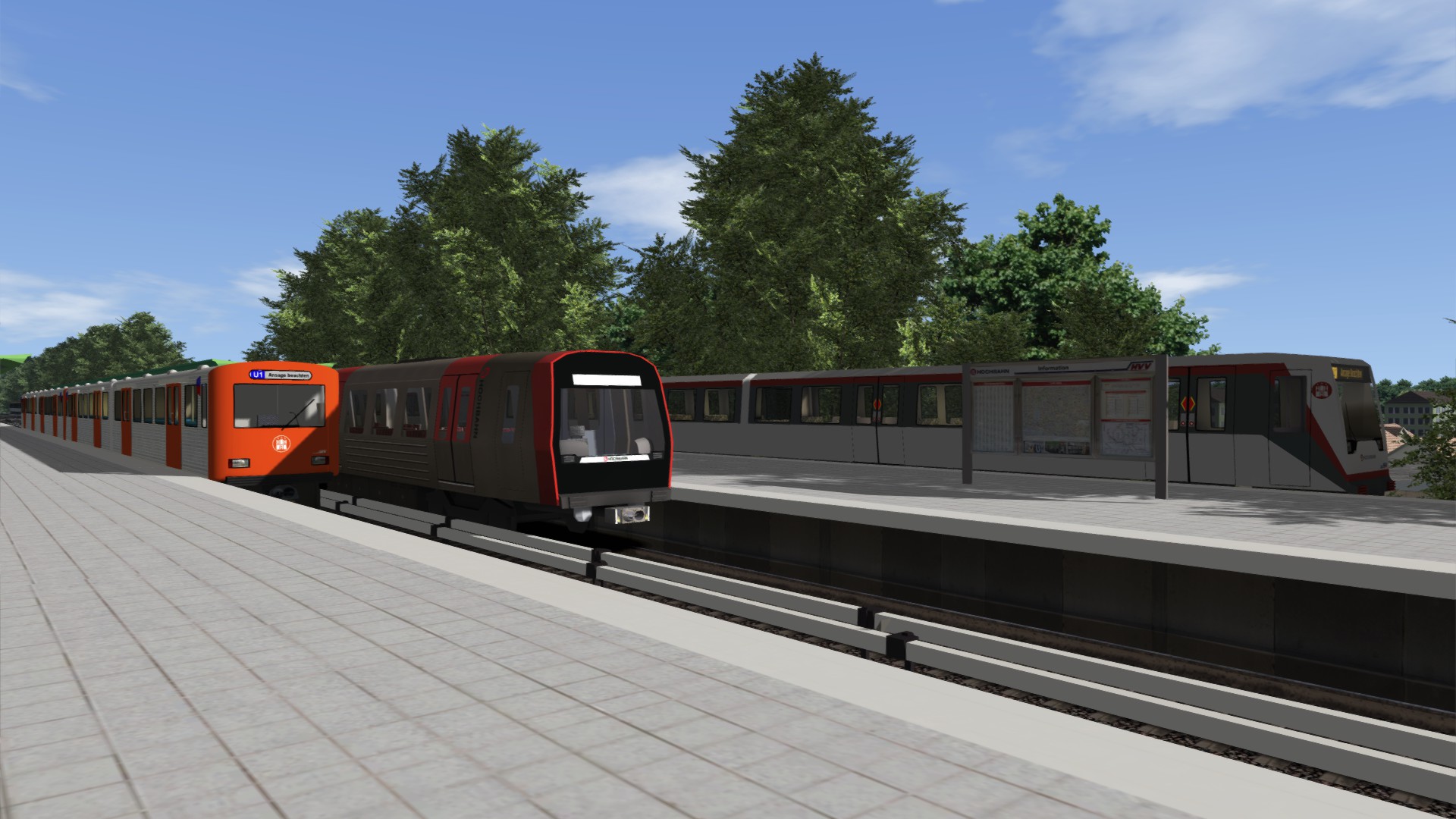 Kleine Fahrzeugparade in Wandsbek-Gartenstadt. Ein DT2E, ein DT5 und ein DT4 stehen an den Bahnsteigen.
